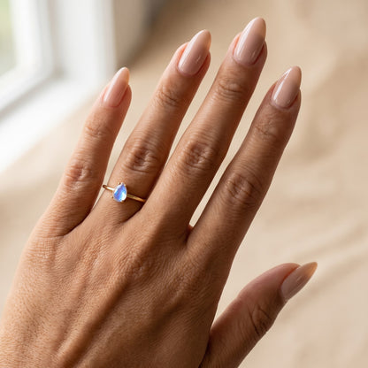 Yellow gold moonstone ring worn on the hand