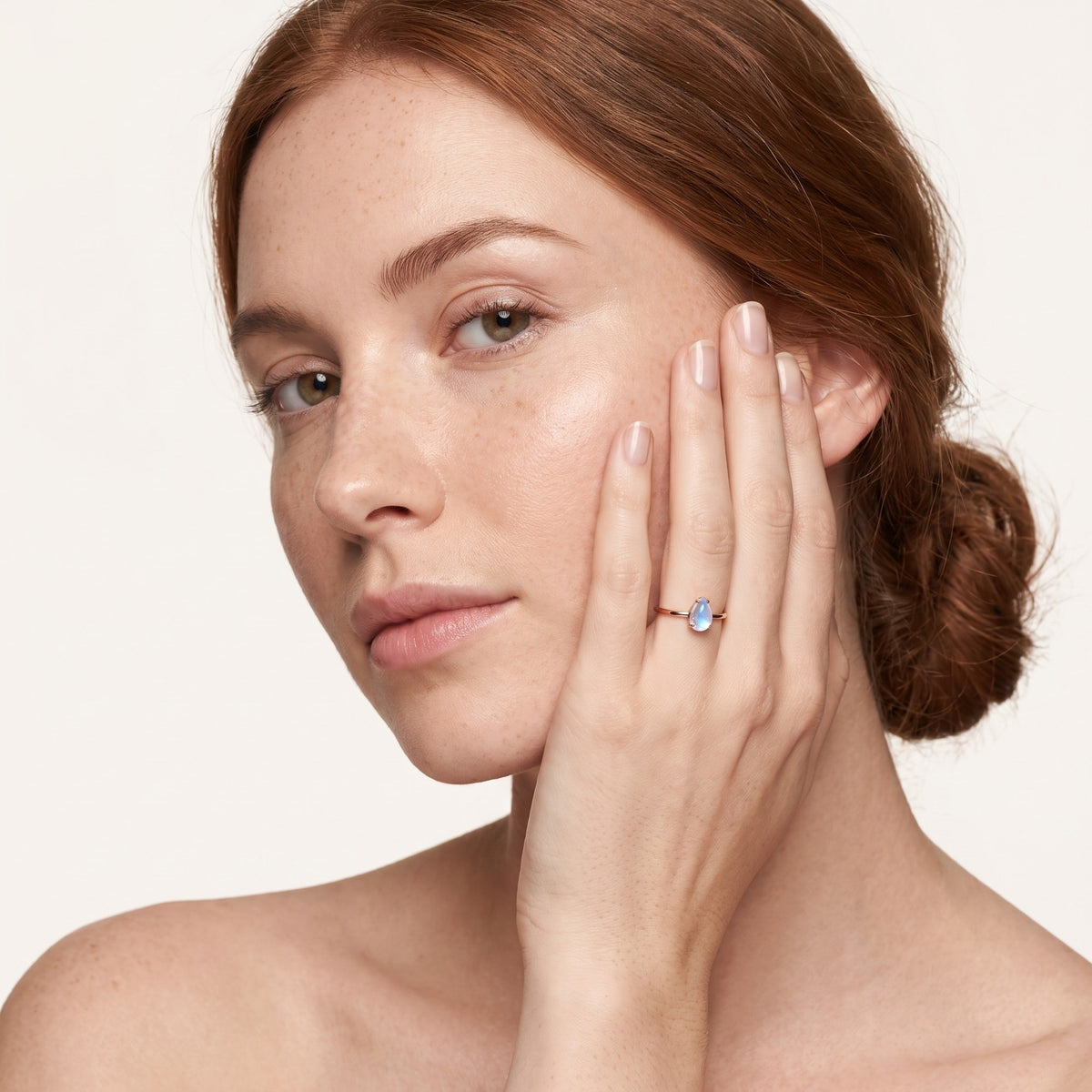 Woman wearing the rose gold moonstone ring