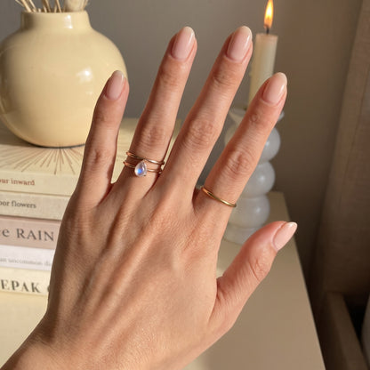 Moonstone ring stacked with thin bands