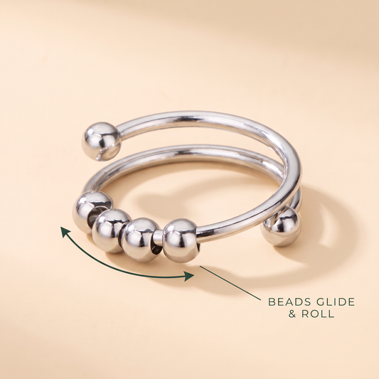 Calm Fidget Ring: 4 beads glide and roll along the coiled band
