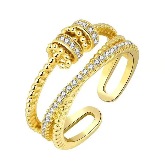 Gold balance spinner ring with sparkling spinning beads
