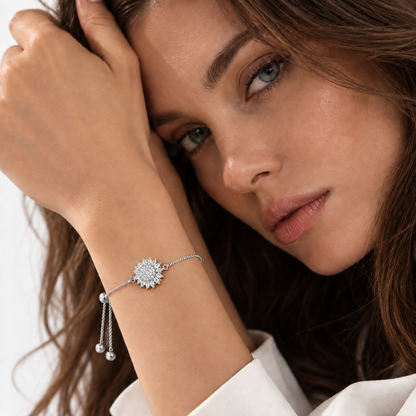 Silver sunflower bracelet worn on the wrist