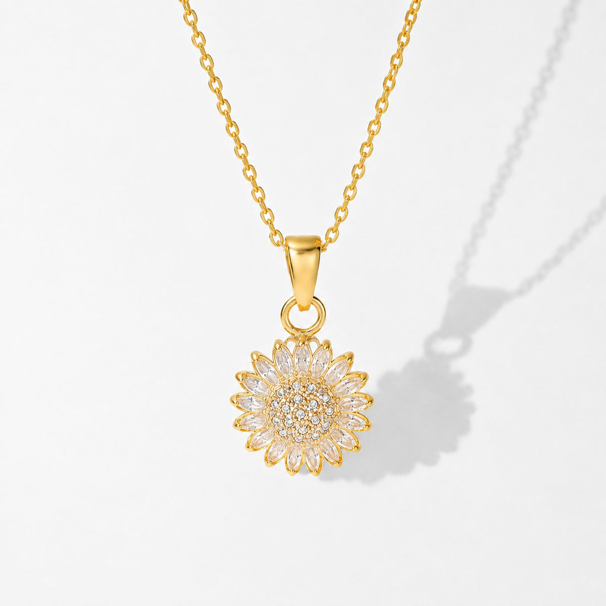 Gold sunflower spinning pendant on its chain