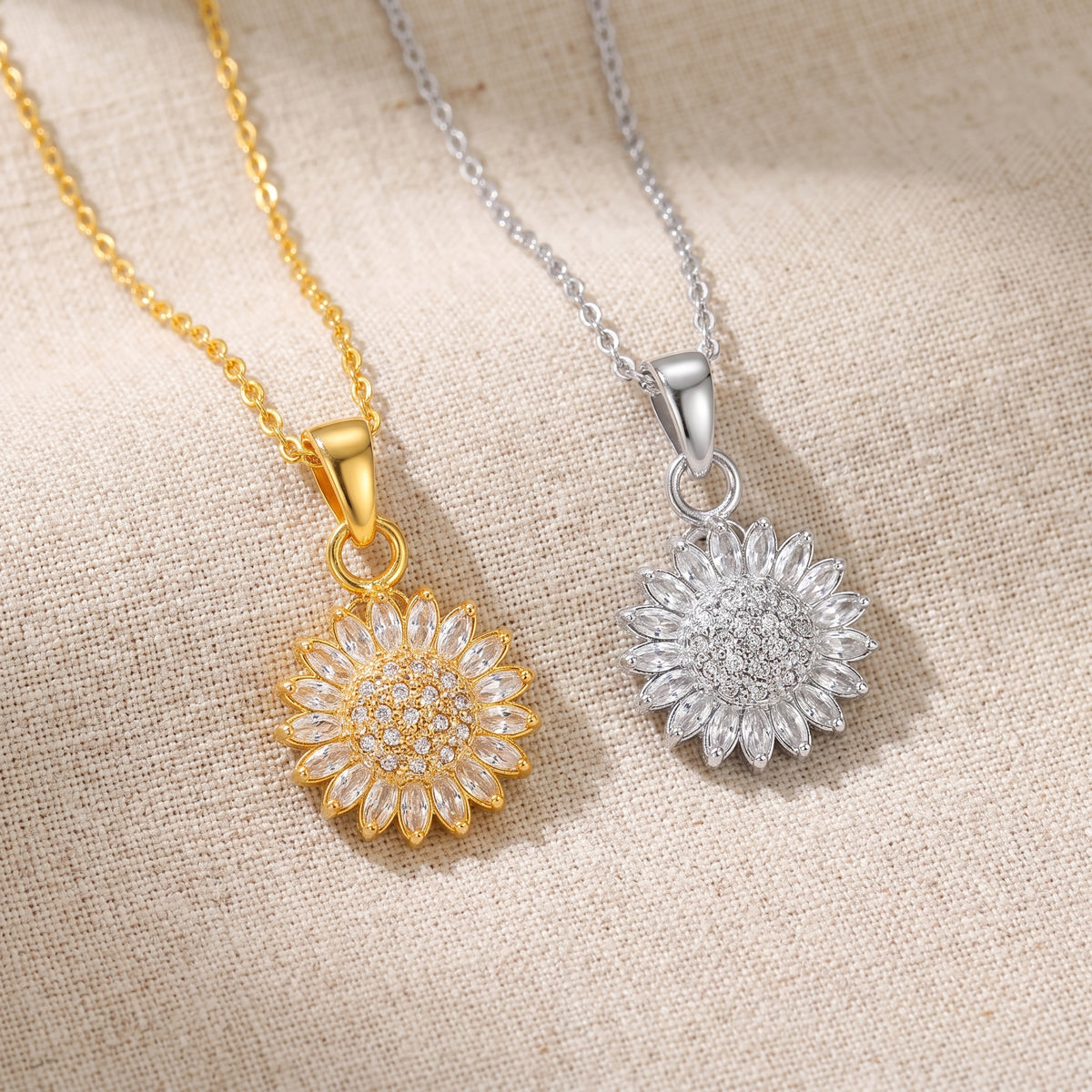 Gold and silver sunflower spinning pendants on linen