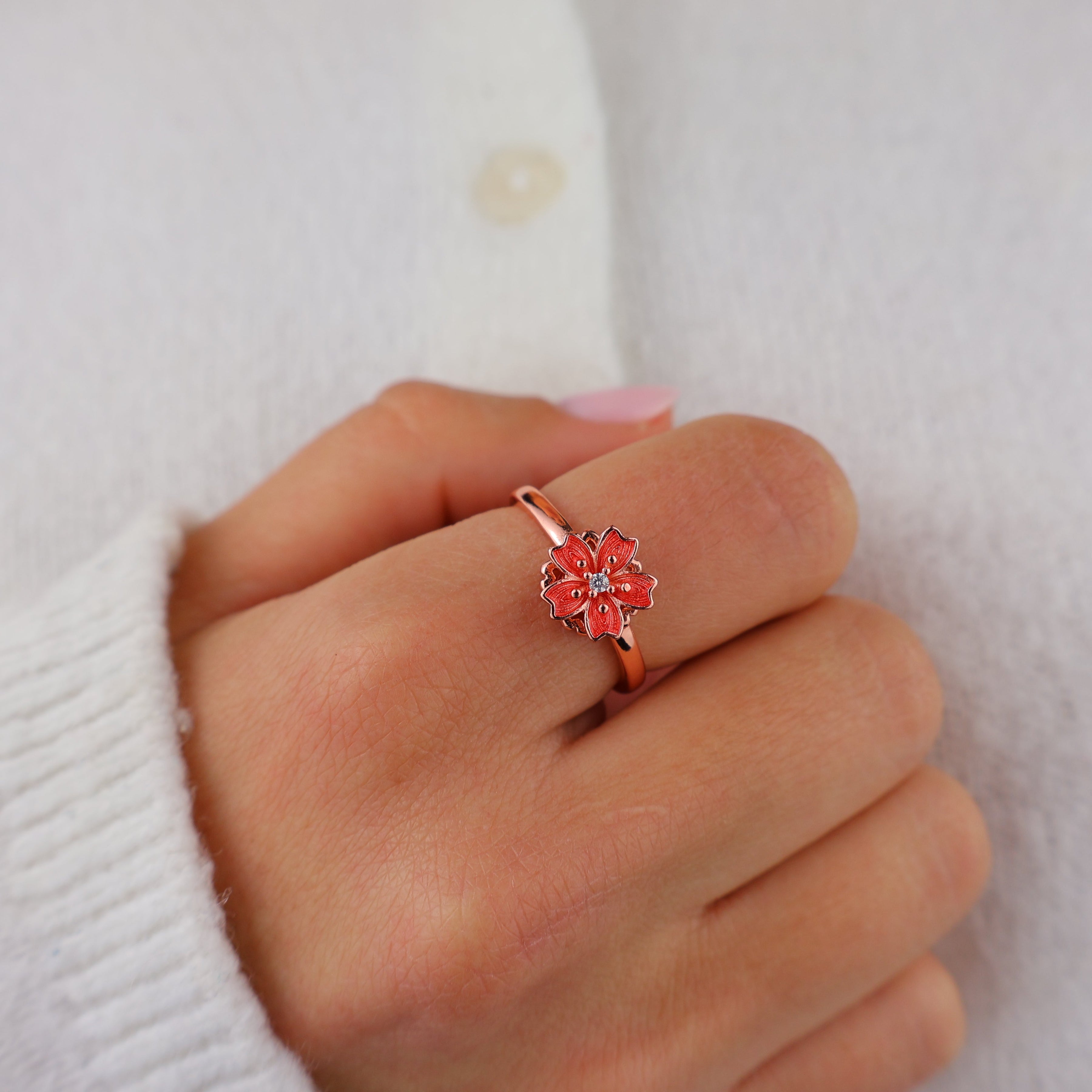 Blossom ring with a cream sweater