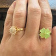 Silver sun spinner ring worn on the hand