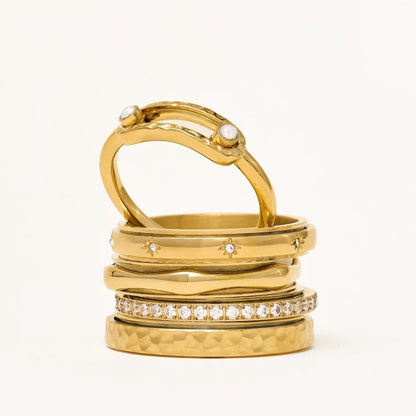 Gold 2-bead ring stacked with other gold rings