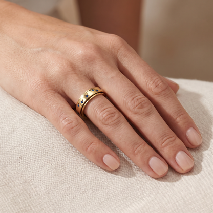 Gold Blue Star Spinning Ring worn on the index finger