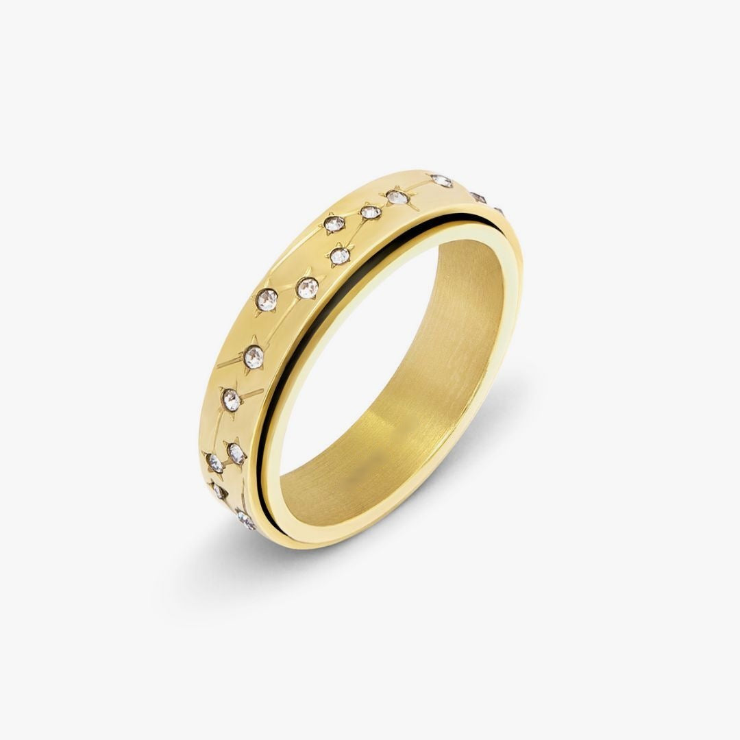 Gold spinning ring with a sparkling star constellation outer band