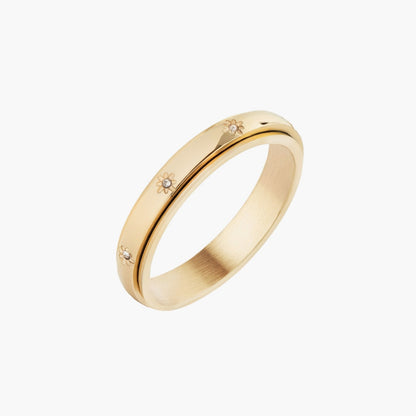 Gold spinning ring with star details and sparkling stones