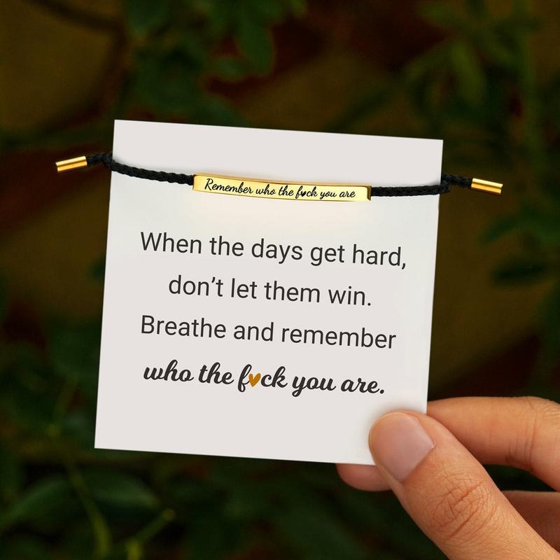 Black and gold Remember Who You Are bracelet