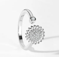 Silver open ring with a spinning crystal sunflower