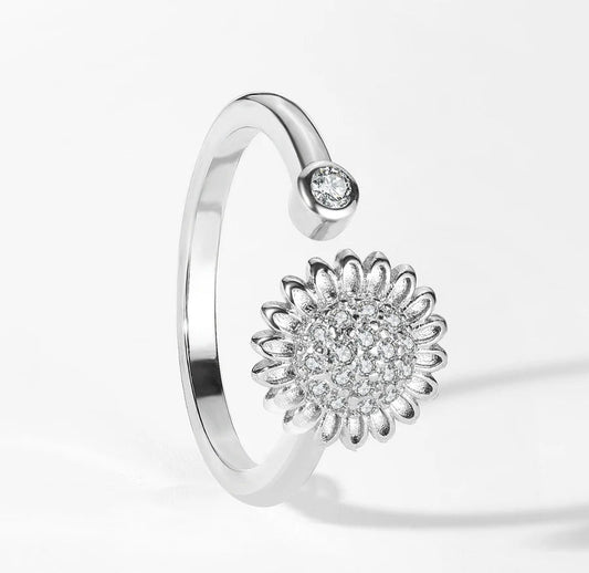 Silver open ring with a spinning crystal sunflower