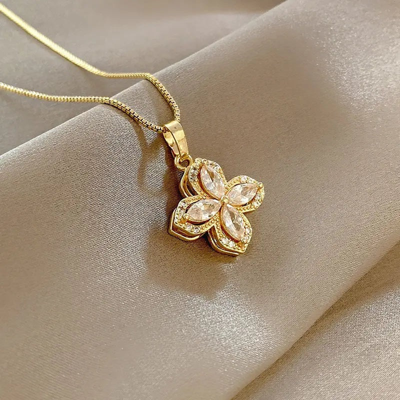 Crystal flower pendant on beige satin