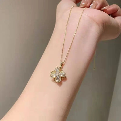 Flower pendant necklace held over the wrist