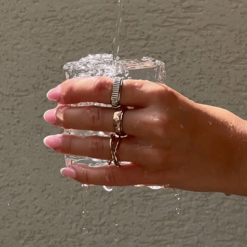 Spinning rings worn under running water