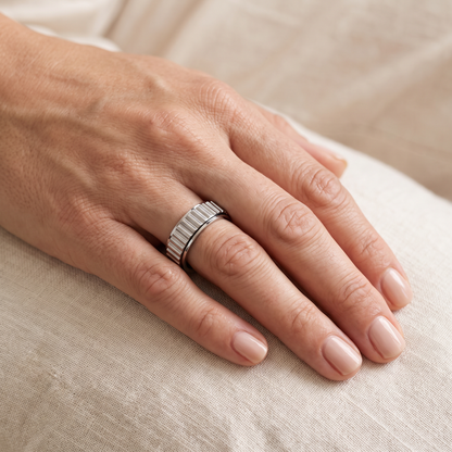Silver Grooved Spinning Ring worn on the index finger