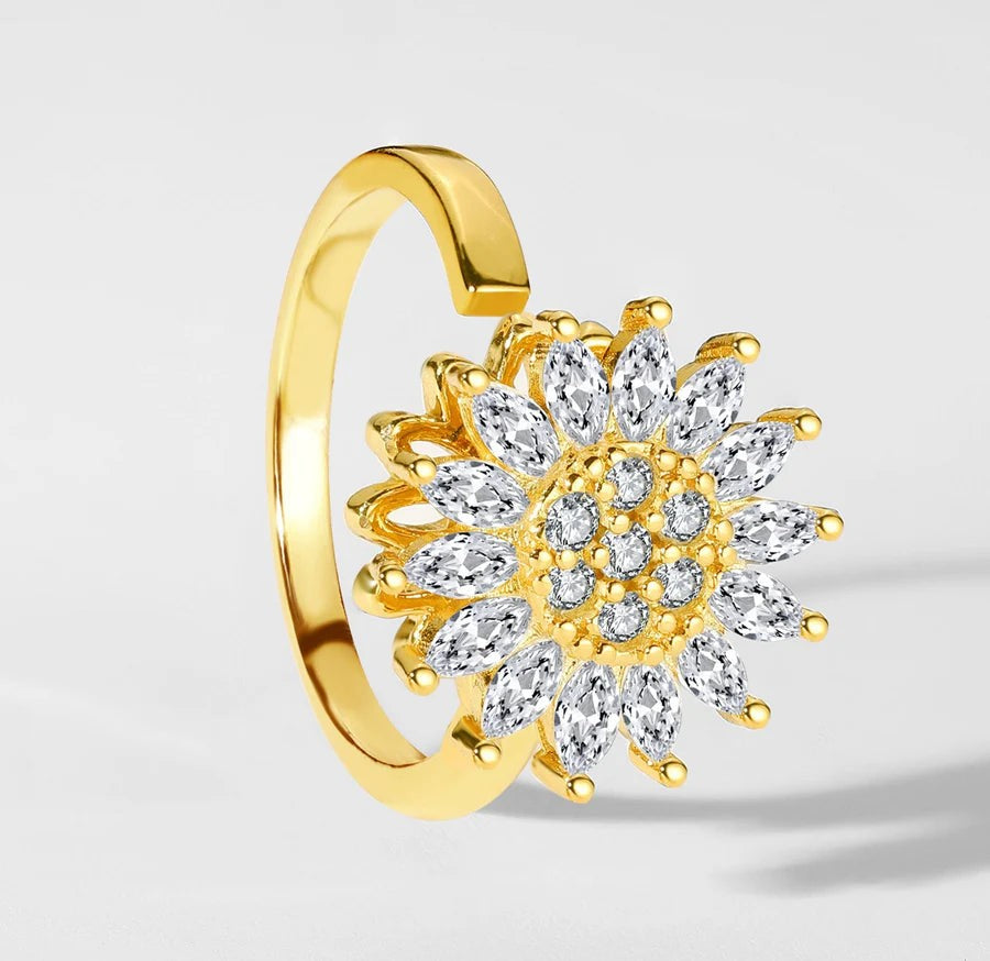 Gold open ring with a spinning crystal sunflower