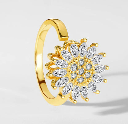 Gold open ring with a spinning crystal sunflower
