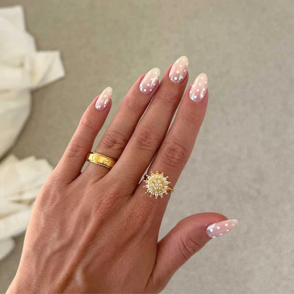 Sunflower spinner ring on the middle finger