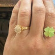 Hand wearing the sunflower spinner ring